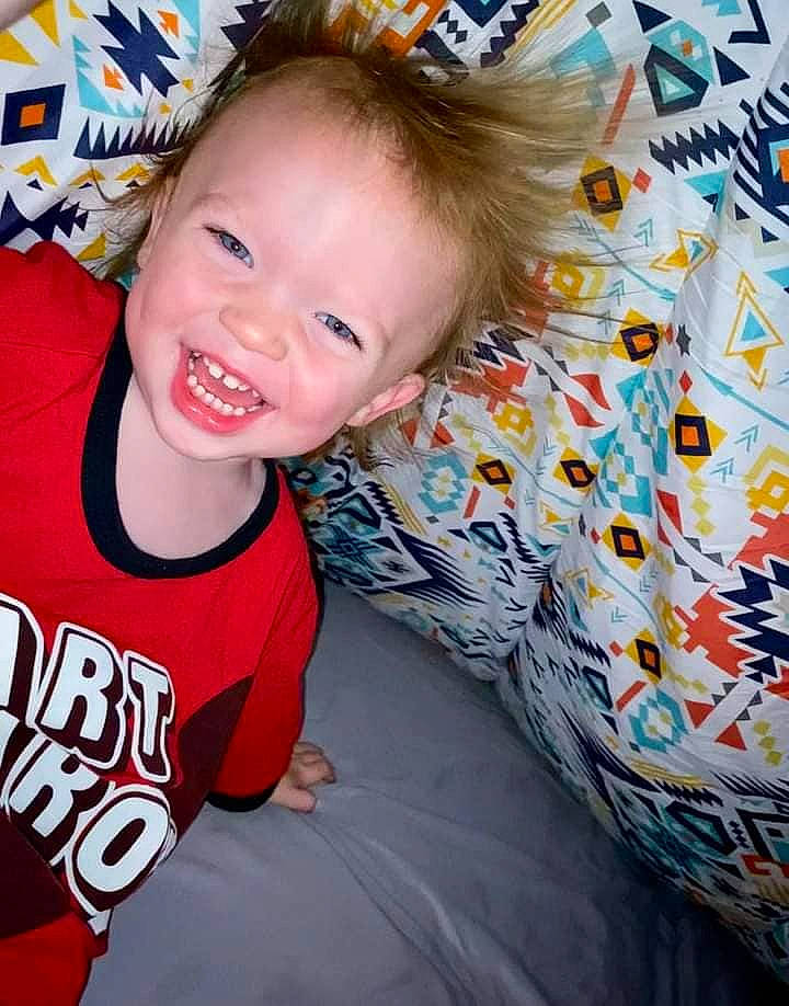 Oakley joined the competition — help win amazing prizes! baby, baby_toddler_clothing, blond, child, cool, event, eye, facial_expression, fun, hairstyle, happy, iris, pattern, person, pink, sitting, sleeve, smile, t_shirt, textile