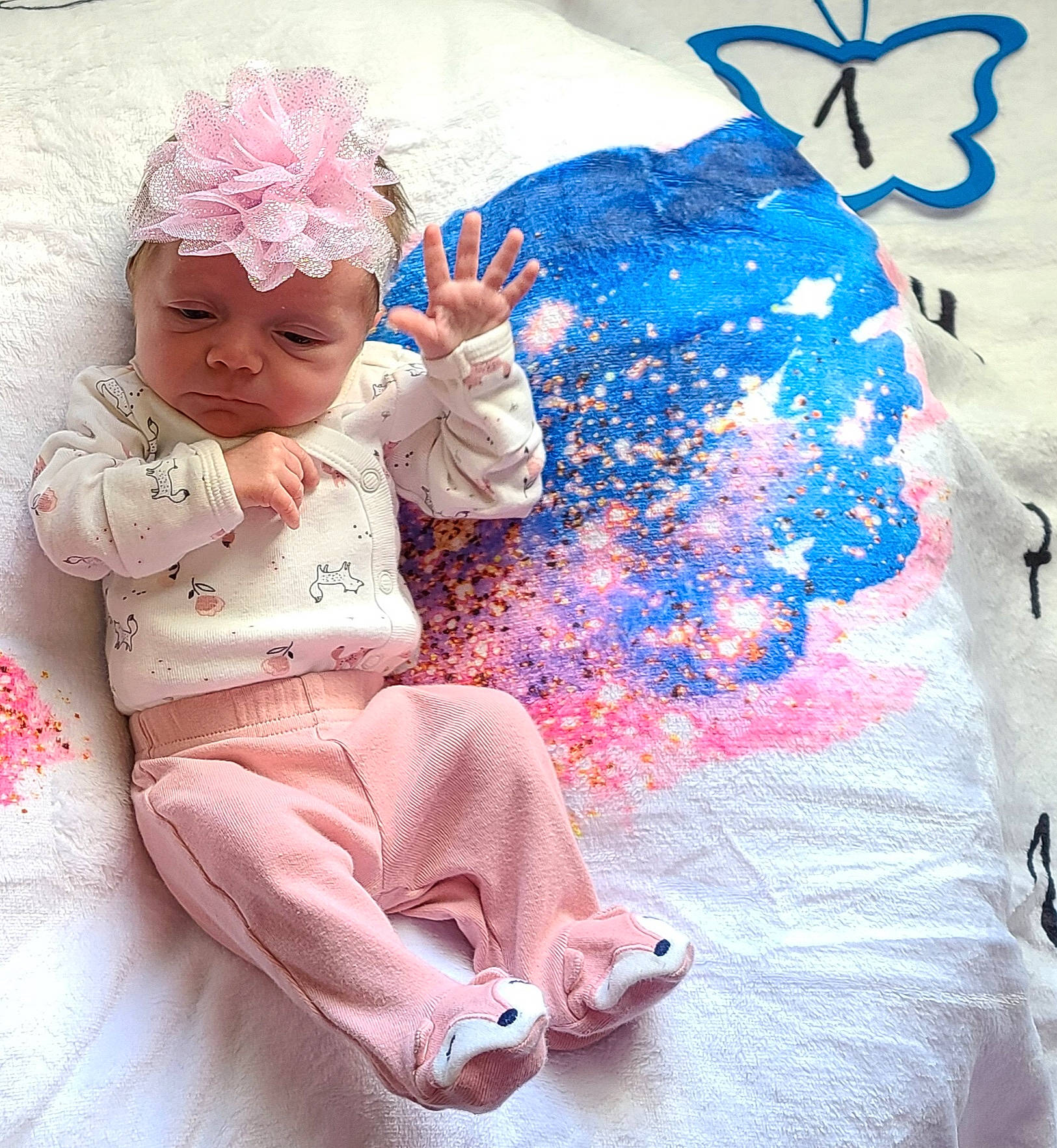 Jaylin is registered to the contest to win money with this photo: baby, baby_toddler_clothing, blue, child, comfort, costume_hat, electric_blue, fun, hairstyle, happy, headgear, headwear, magenta, pattern, person, pink, product, purple, sitting, textile