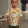beachwear, boy, child, clothing, door, face, footwear, head, male, pants, person, photography, portrait, shirt, shoe, shorts, sleeve, sneaker, standing, t_shirt