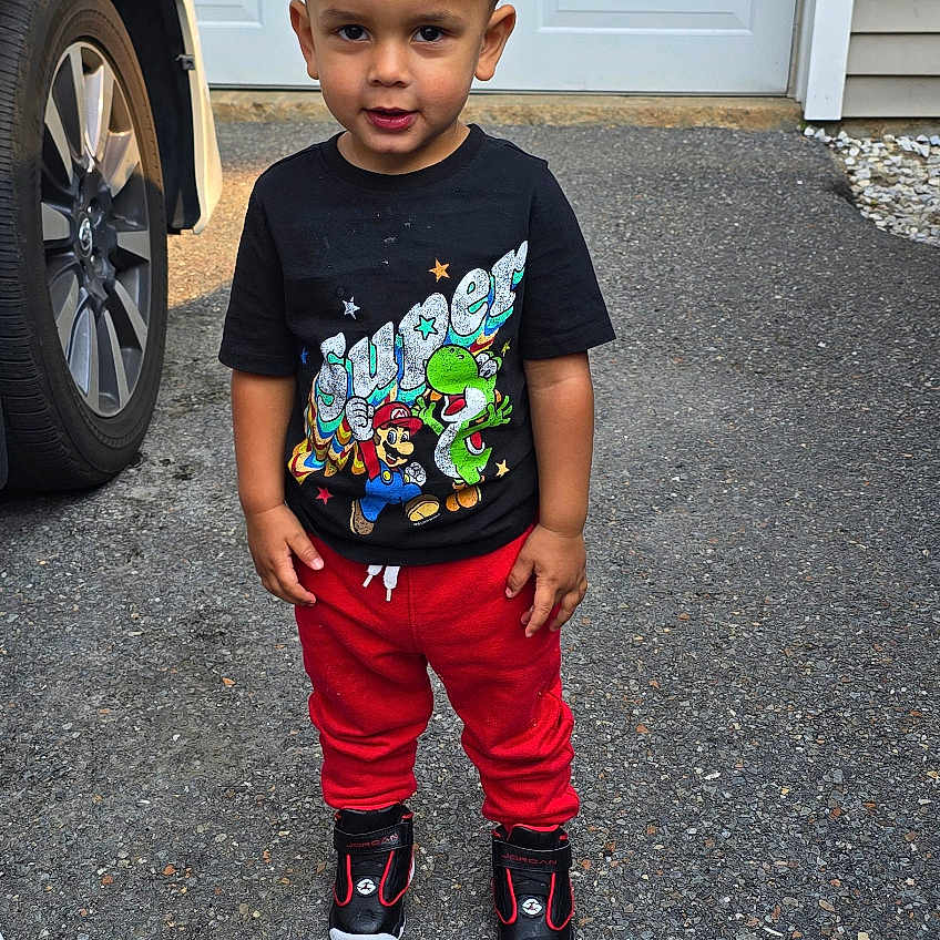 Jaycob is registered to the contest to win money with this photo: alloywheel, car, carwheel, clothing, face, footwear, head, machine, pants, person, photography, portrait, shoe, shorts, spoke, t_shirt, tire, transportation, vehicle, wheel