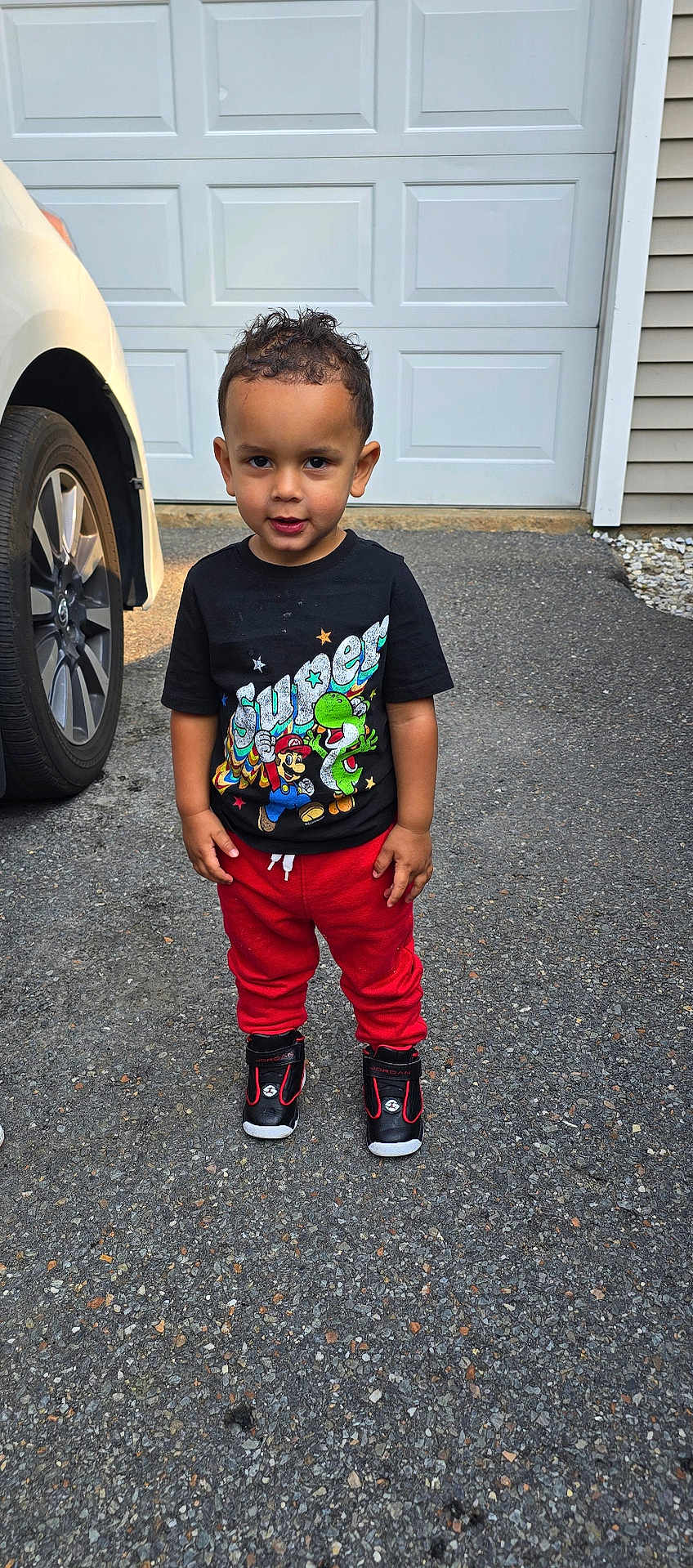 Jaycob is registered to the contest to win money with this photo: alloywheel, car, carwheel, clothing, face, footwear, head, machine, pants, person, photography, portrait, shoe, shorts, spoke, t_shirt, tire, transportation, vehicle, wheel