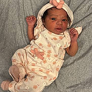 Reign joined the competition — help win amazing prizes! baby, infant, child, floral_outfit, headband, flower, blanket, playpen, cute, newborn, lying_down, pink, soft, small_hands, clothing, portrait, indoors, sleepwear, cozy, adorable
