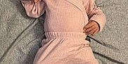 Reign is registered to the contest to win money with this photo: baby, infant, pink_clothing, headband, blanket, footwear, booties, bear_design, lying_down, cute, cozy, soft_textile, sleepwear, child, portrait, indoors, baby_girl, expression, small_hands, fabric