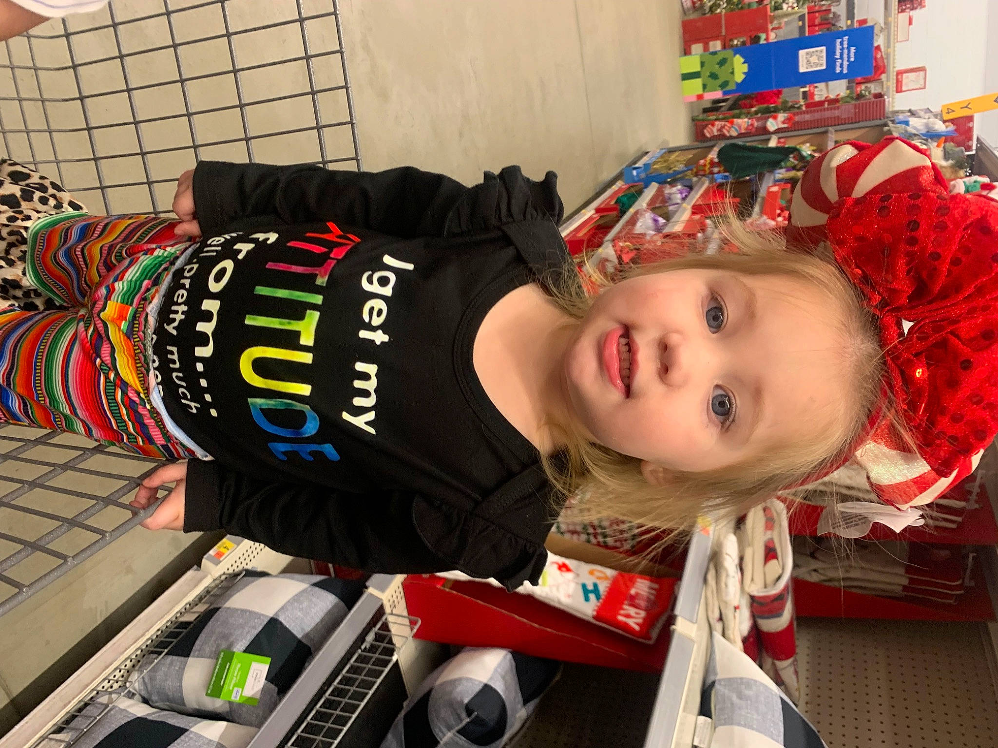 Blakeleigh is registered to the contest to win money with this photo: baby, carmine, child, costume, fun, helmet, pattern, person, personal_protective_equipment, room, smile, sportswear, t_shirt, toddler, toy