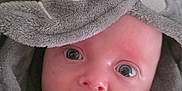 Seb is registered to the contest to win money with this photo: baby, towel, elephant, face, expression, wide_eyes, soft_texture, cute, infant, hooded_towel, skin, closeup, indoor, child, portrait, wrapped, cozy, warm, curious, mouth_open
