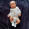 Lolani joined the competition — help win amazing prizes! baby, infant, smiling, onesie, floral_pattern, socks, pigtails, lying_down, blanket, cute, happy, child, portrait, soft_texture, indoor, skin, small_hands, small_feet, young_child, adorable