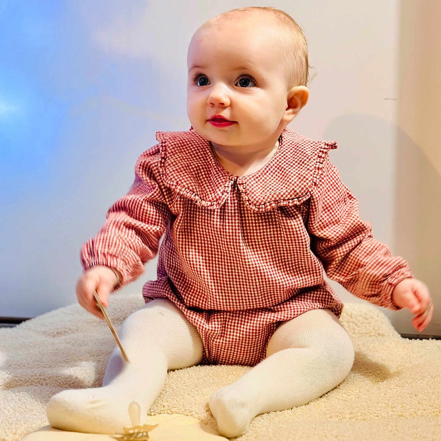 Livy participe au concours pour gagner de l'argent avec cette photo : baby, blanket, child, cozy, curious, cute, floor, hands, indoors, infant, pacifier, portrait, red_checkered_clothing, sitting, smiling, soft_lighting, toddler, toy, white_tights, young_child
