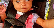Jayda joined the competition — help win amazing prizes! baby, infant, car_seat, headband, pink_clothing, baby_bottle, blanket, straps, safety, cute, child, portrait, close_up, indoors, seatbelt, expression, face, person, newborn, soft_toys