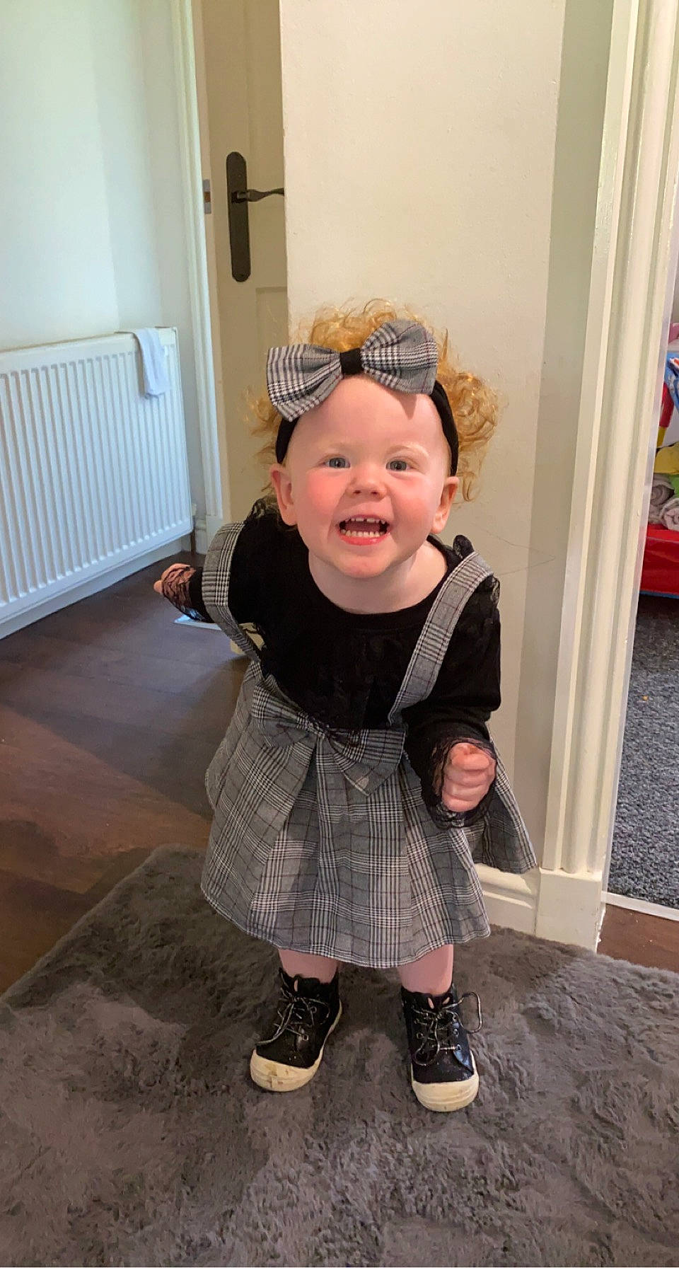 Arya Hopkins is registered to the contest to win money with this photo: baby, baby_toddler_clothing, boot, child, door, fashion_accessory, flooring, fun, hairstyle, happy, hat, headgear, headwear, helmet, pattern, person, personal_protective_equipment, sitting, sleeve, smile