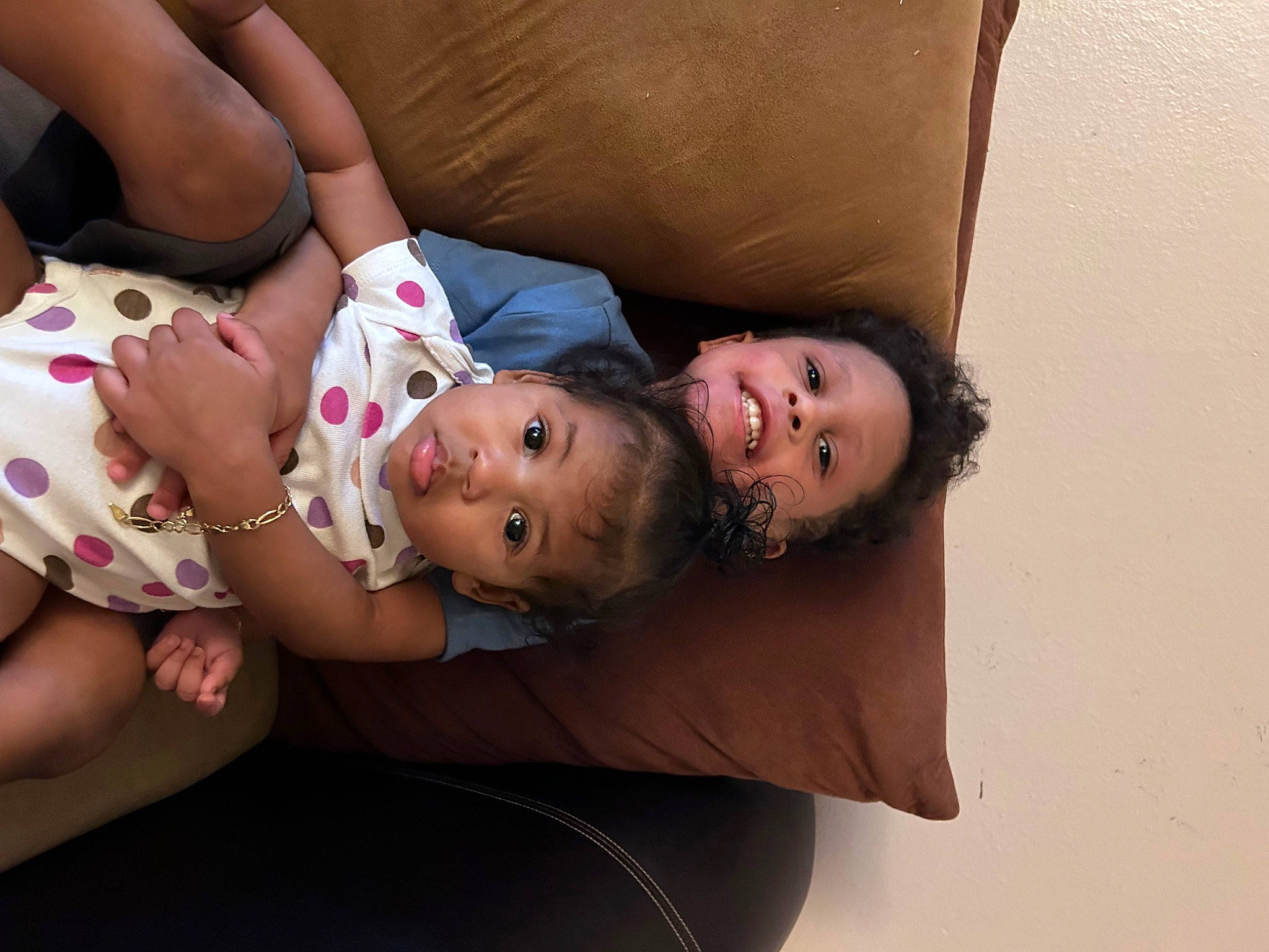 Josiah is registered to the contest to win money with this photo: abdomen, baby, baby_toddler_clothing, cheek, child, comfort, couch, elbow, eye, face, fun, happy, human_body, lip, mouth, nose, person, skin, stomach, toddler