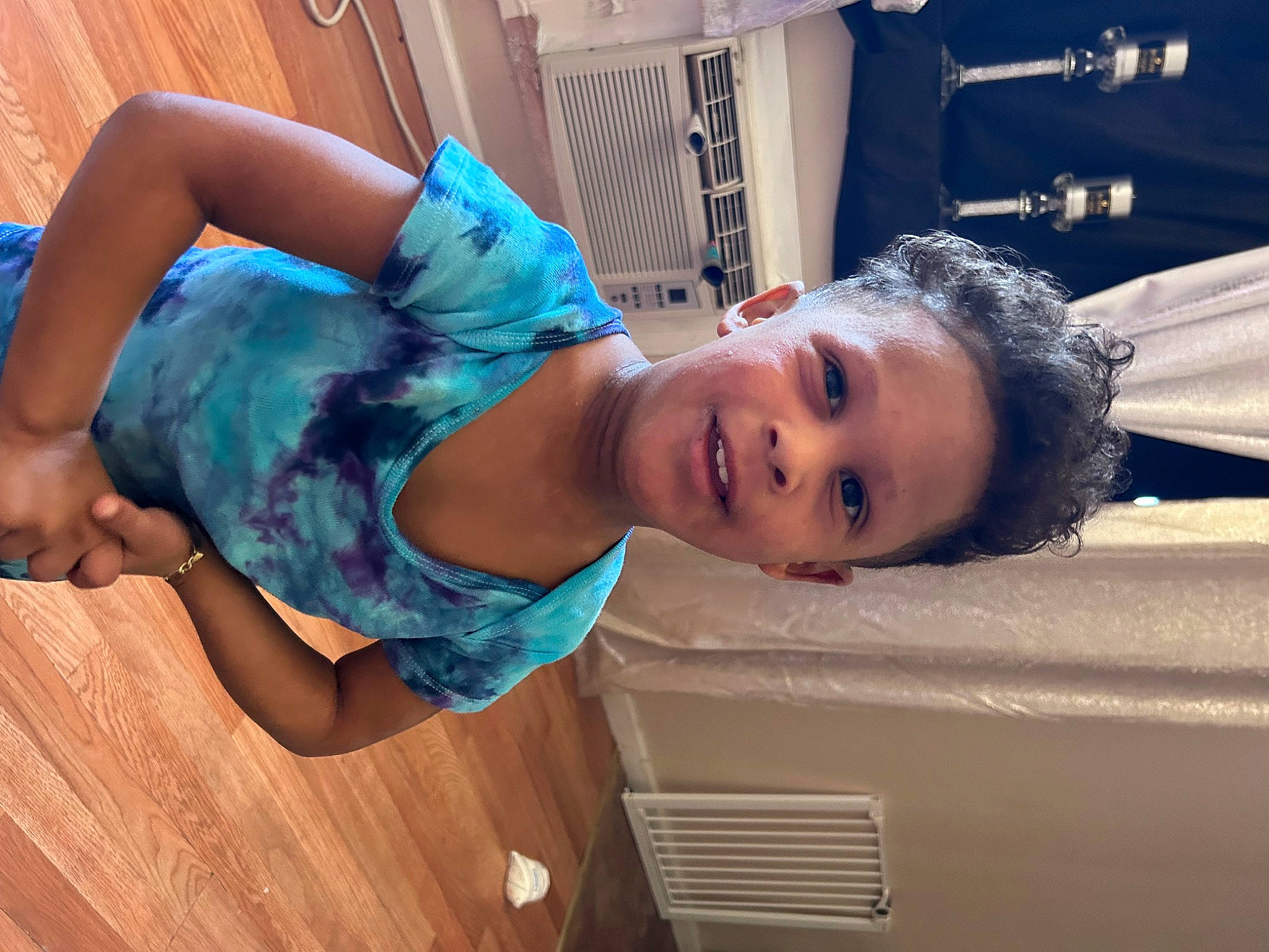 Josiah is registered to the contest to win money with this photo: abdomen, child, elbow, electric_blue, facial_expression, fun, happy, hardwood, human_leg, joint, leisure, mouth, muscle, person, room, shoulder, smile, thigh, toddler, trunk