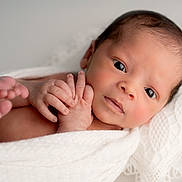 Matias is registered to the contest to win money with this photo: newborn, baby, infant, wrapped, blanket, white, soft, pillow, lace, hands, feet, closeup, portrait, skin, cute, peaceful, lying_down, indoors, sleepy, toddler