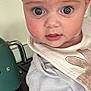 Reese is registered to the contest to win money with this photo: appliance, baby, bib, child, close_up, clothing, curious, cute, expression, eyes, face, head, indoors, infant, kettle, kitchen, person, rosy_cheeks, white, young