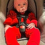baby, infant, car_seat, pacifier, red_clothing, striped_hat, white_socks, safety_harness, child, cute, indoor, person, seat, babywearing, closeup, expression, small_hands, soft_lighting, portrait, young_child