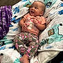 baby, child, smiling, blanket, colorful, patterned, pants, shirt, mushroom, floral, happy, indoor, chair, foot, cute, cozy, person, infant, relaxed, toddler