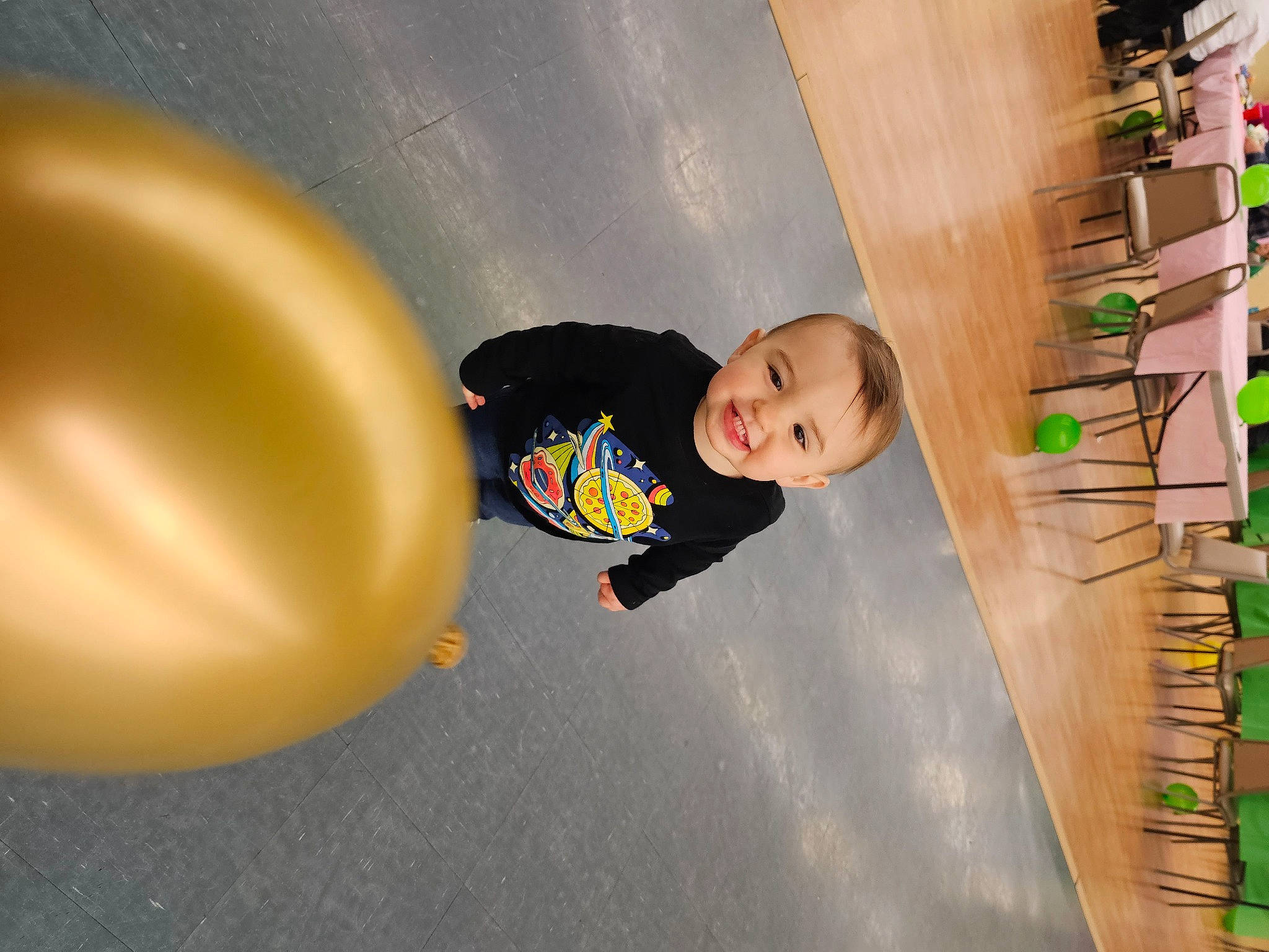 Lane is registered to the contest to win money with this photo: asphalt, baby, child, circle, concrete, floor, flooring, fun, hardwood, joy, leisure, material_property, person, play, recreation, road_surface, shelf, standing, toddler, tree