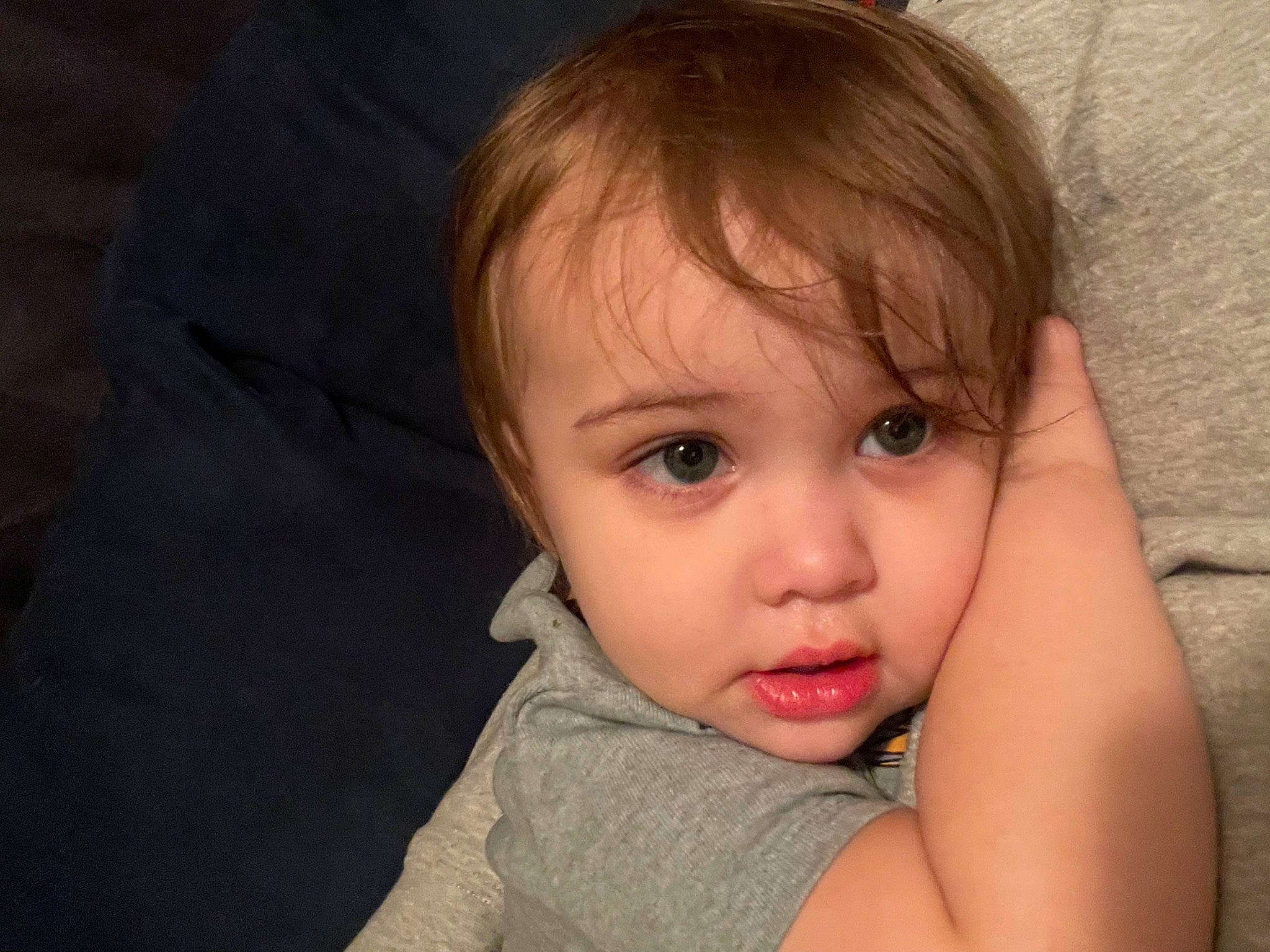 Cairo is registered to the contest to win money with this photo: arm, brown_hair, cheek, comfort, ear, eyelash, flash_photography, fun, gesture, hair, happy, human_body, iris, lip, nose, person, skin, smile, thumb, toddler