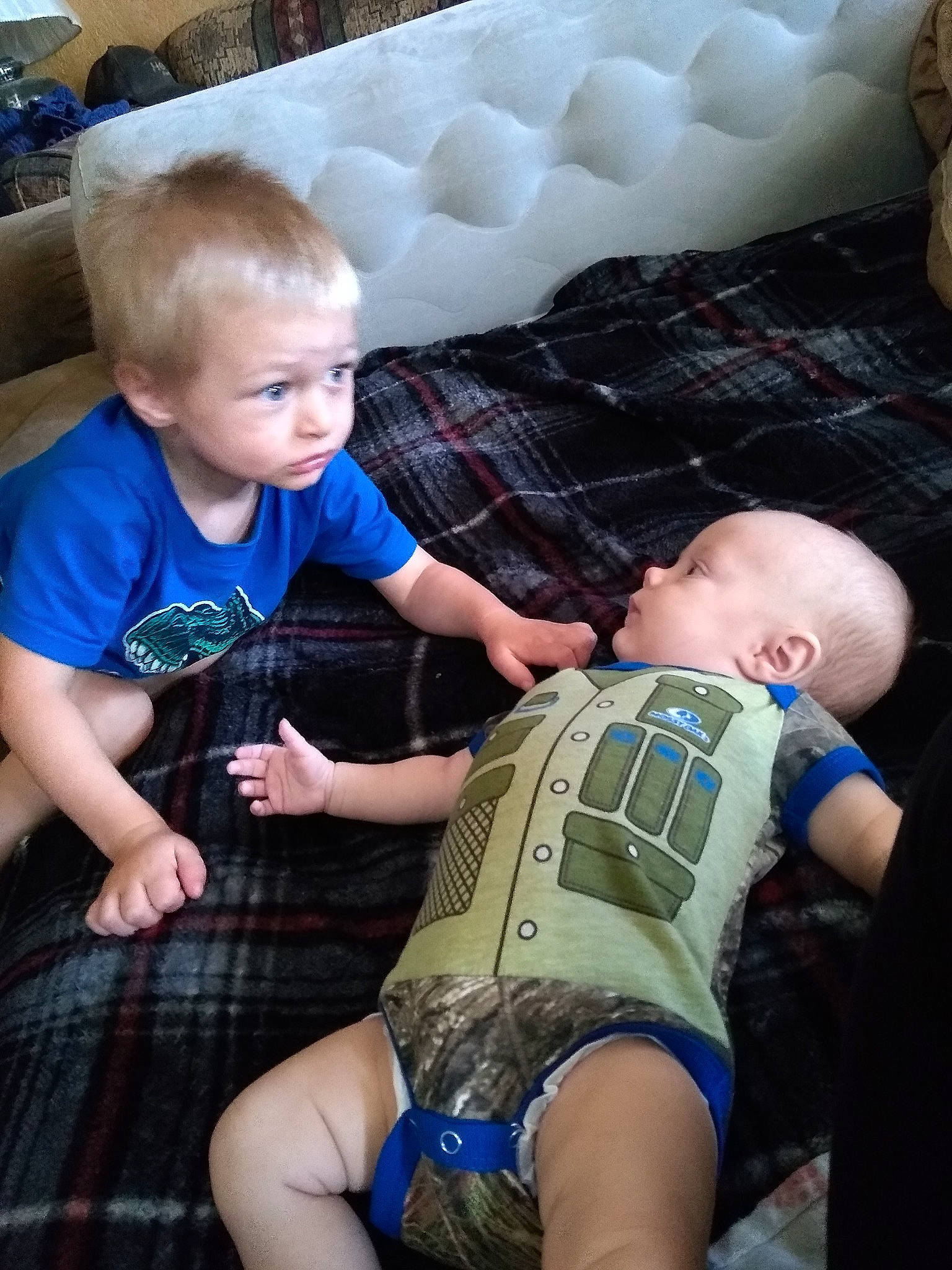 Rocky is registered to the contest to win money with this photo: abdomen, baby, child, fun, lap, leg, person, sitting, thigh, toddler, vacation