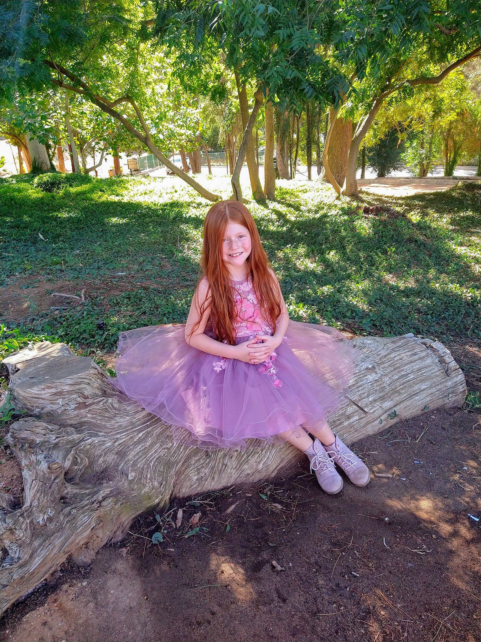 Sophia is registered to the contest to win money with this photo: branch, dress, eye, fawn, flash_photography, forest, formal_wear, grass, happy, headpiece, joy, landscape, leisure, long_hair, magenta, people_in_nature, person, plant, sunlight, tints_and_shades