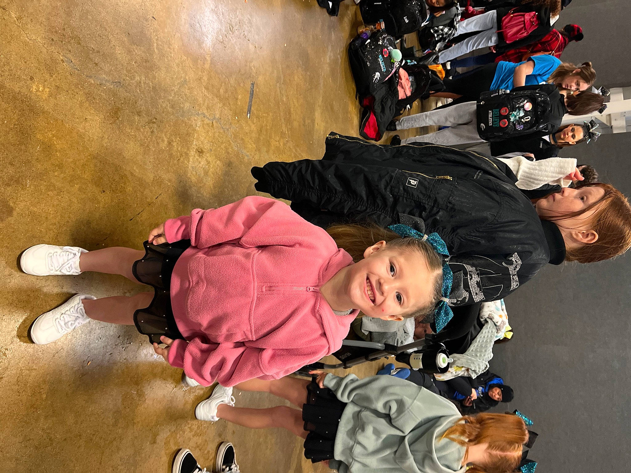 Quinn is registered to the contest to win money with this photo: baby, baby_carriage, baby_products, baby_toddler_clothing, child, fun, happy, headwear, jacket, joy, leisure, luggage_and_bags, person, personal_protective_equipment, recreation, smile, sneakers, toddler, travel, white