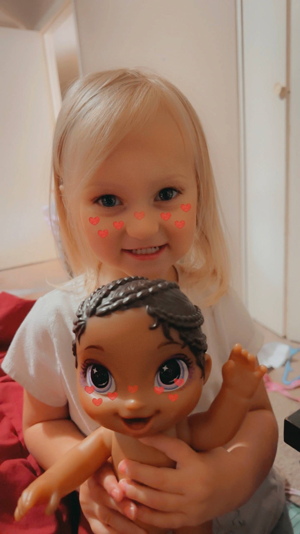 Dakota is registered to the contest to win money with this photo: cheek, chin, doll, ear, eye, eyebrow, eyelash, forehead, hair, hand, human_body, joint, joy, lip, mouth, neck, nose, person, shoulder, skin