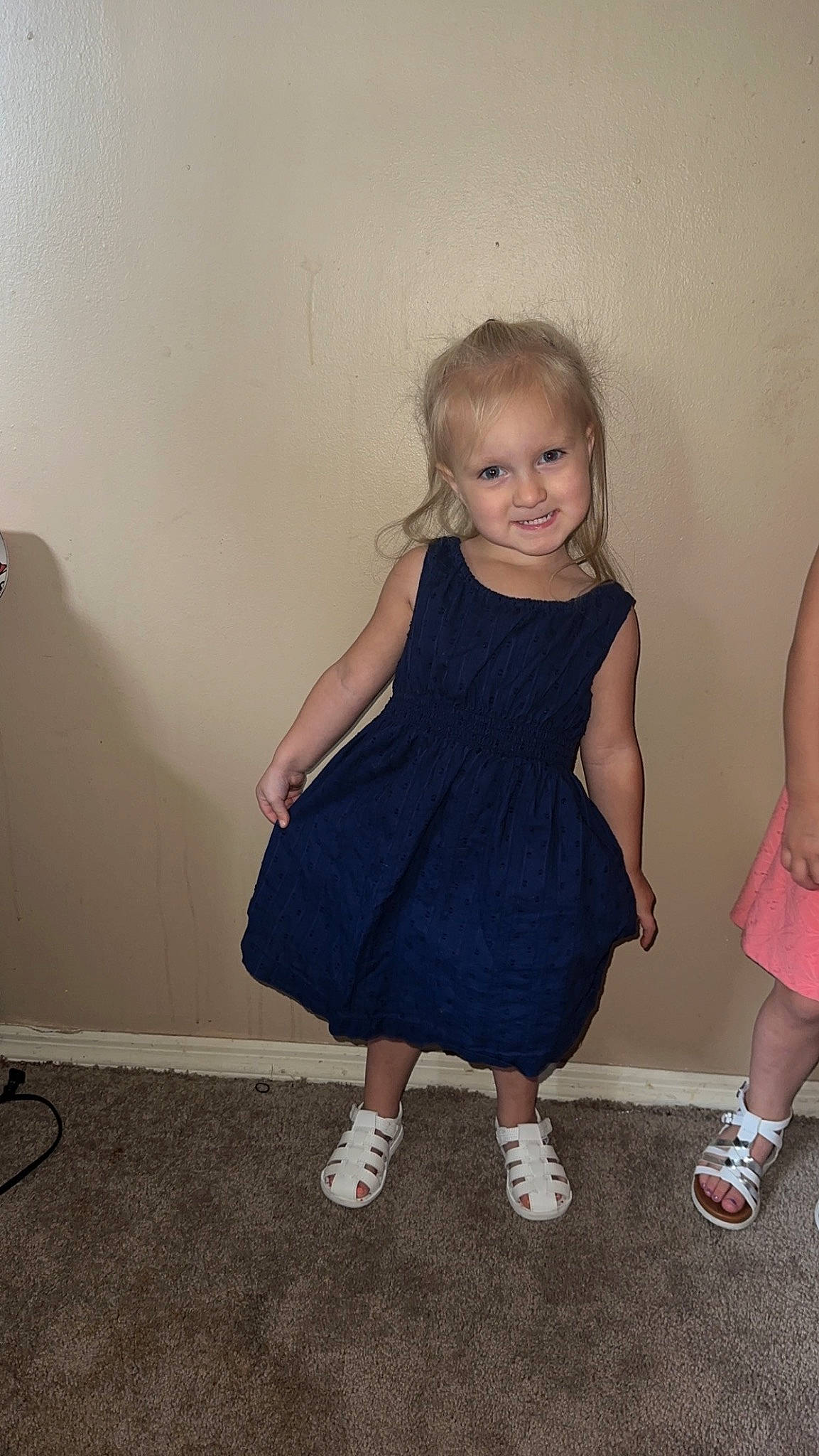Dakota is registered to the contest to win money with this photo: baby_toddler_clothing, blond, day_dress, dress, event, facial_expression, flash_photography, flooring, formal_wear, fun, gesture, happy, human_leg, iris, joy, one_piece_garment, person, shoulder, skin, smile