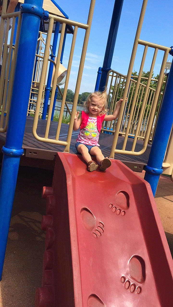 Haleigh is registered to the contest to win money with this photo: child, chute, city, fun, human_settlement, joy, leisure, outdoor_play_equipment, person, play, playground, playground_slide, public_space, recreation, toddler, vacation