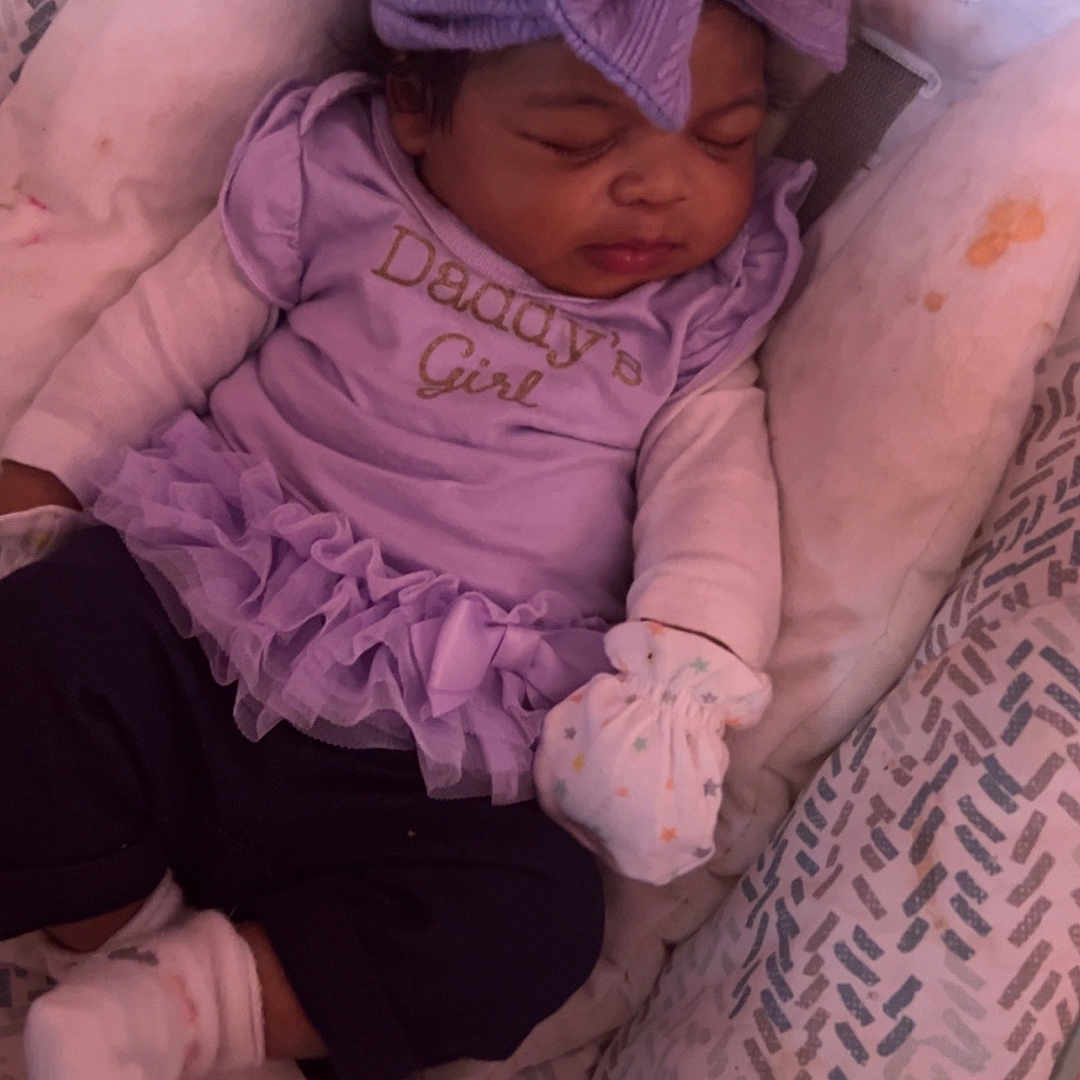 Amara Renee Lior is registered to the contest to win money with this photo: baby, beanie, bed, blanket, bonnet, cap, clothing, couch, cradle, crib, face, furniture, hat, head, infantbed, newborn, person, photography, portrait, sleeping