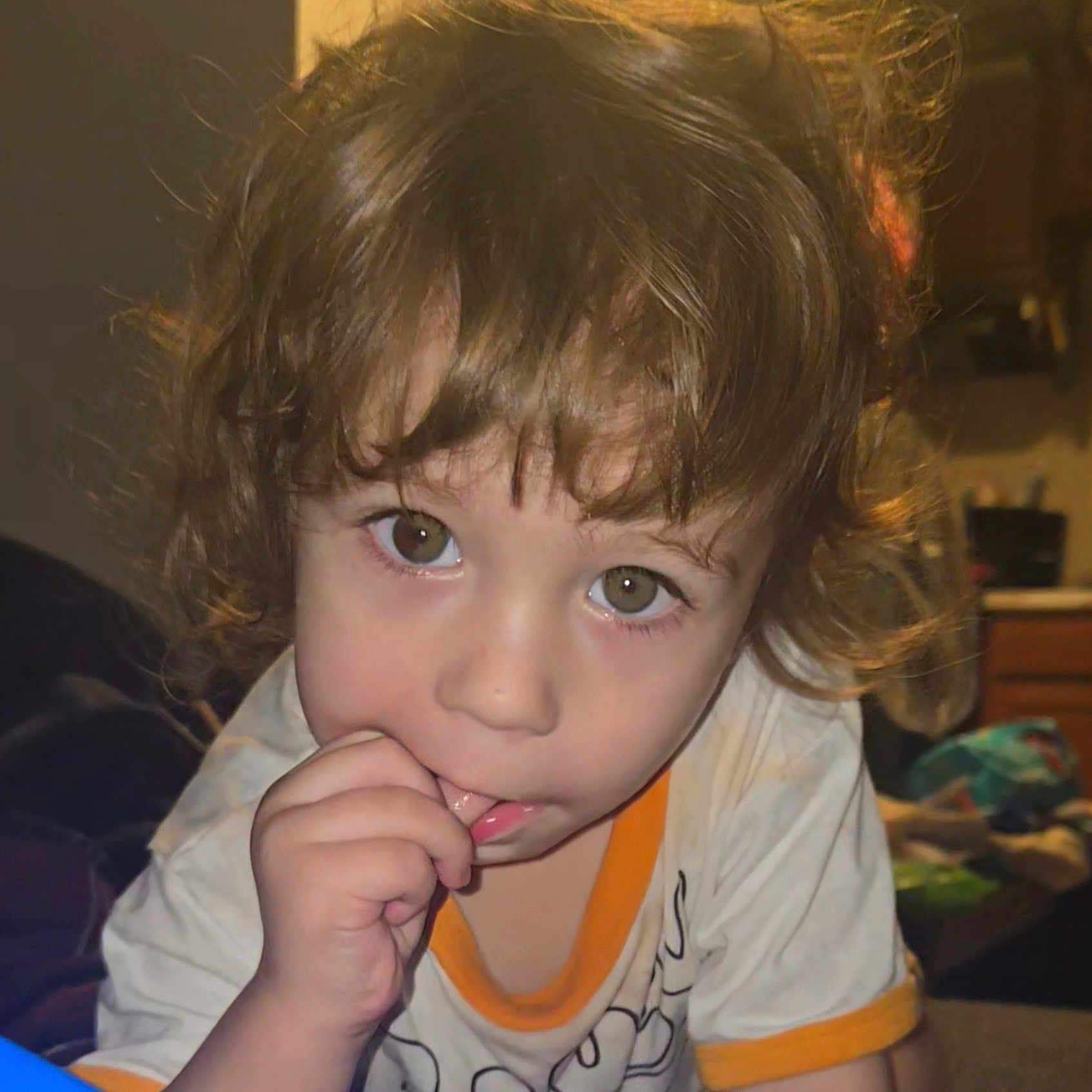 Michael joined the competition — help win amazing prizes! baby, biting, blonde, bodypart, clothing, cosmetics, couch, eating, face, finger, food, furniture, hair, hand, head, lipstick, person, photography, portrait, t_shirt