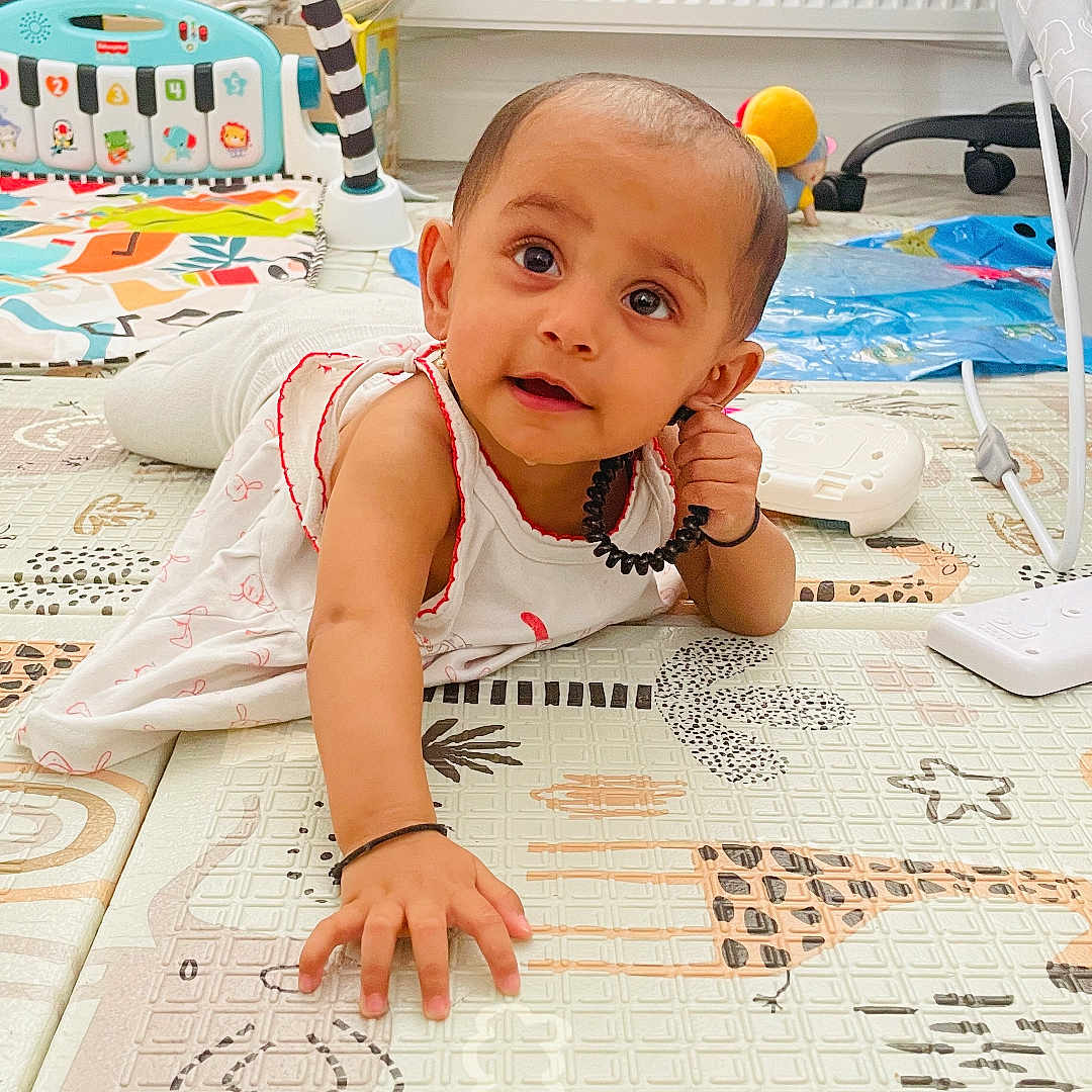 Speshal joined the competition — help win amazing prizes! baby, bracelet, child, clothing, colorful, crawling, curious, expression, floor, furniture, hand, head, indoor, person, play_mat, playtime, radiator, reaching, soft_lighting, toy