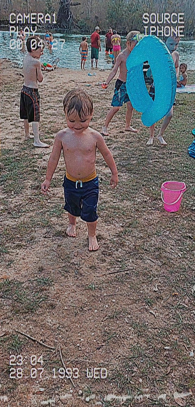 Brayden is registered to the contest to win money with this photo: adaptation, barefoot, board_short, child, fun, human, human_settlement, leg, leisure, people, people_in_nature, people_on_beach, person, public_space, sand, shorts, standing, t_shirt, toddler, trunks