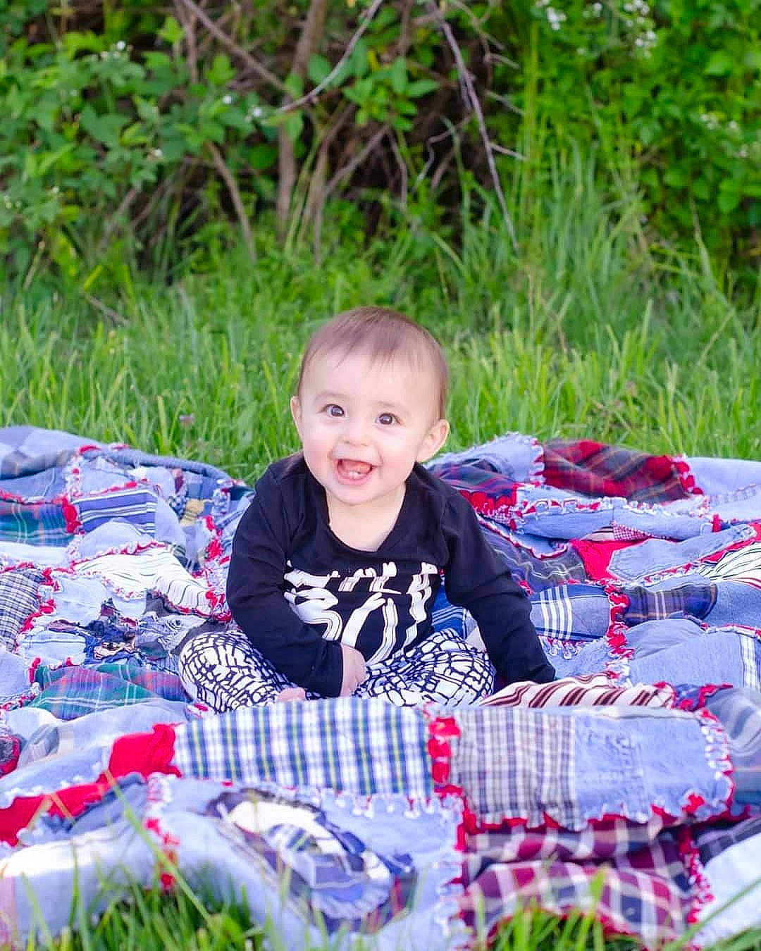 Crue is registered to the contest to win money with this photo: baby, child, event, grass, joy, linens, person, picnic, plant, play, recreation, sitting, summer, textile, toddler
