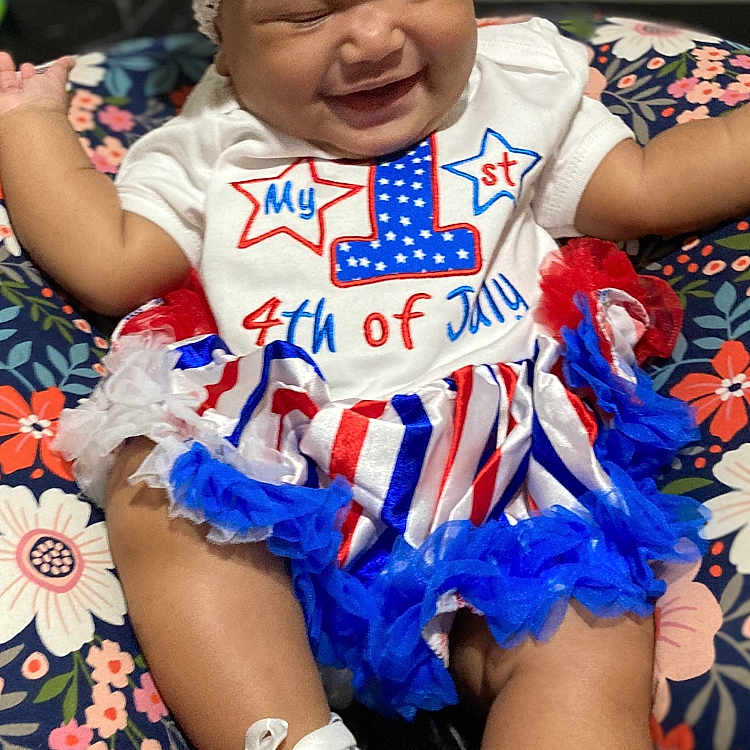 Paisley joined the competition — help win amazing prizes! baby, bodypart, clothing, couch, face, finger, footwear, furniture, glove, hand, hat, head, newborn, person, photography, portrait, shoe, shorts, sneaker, t_shirt