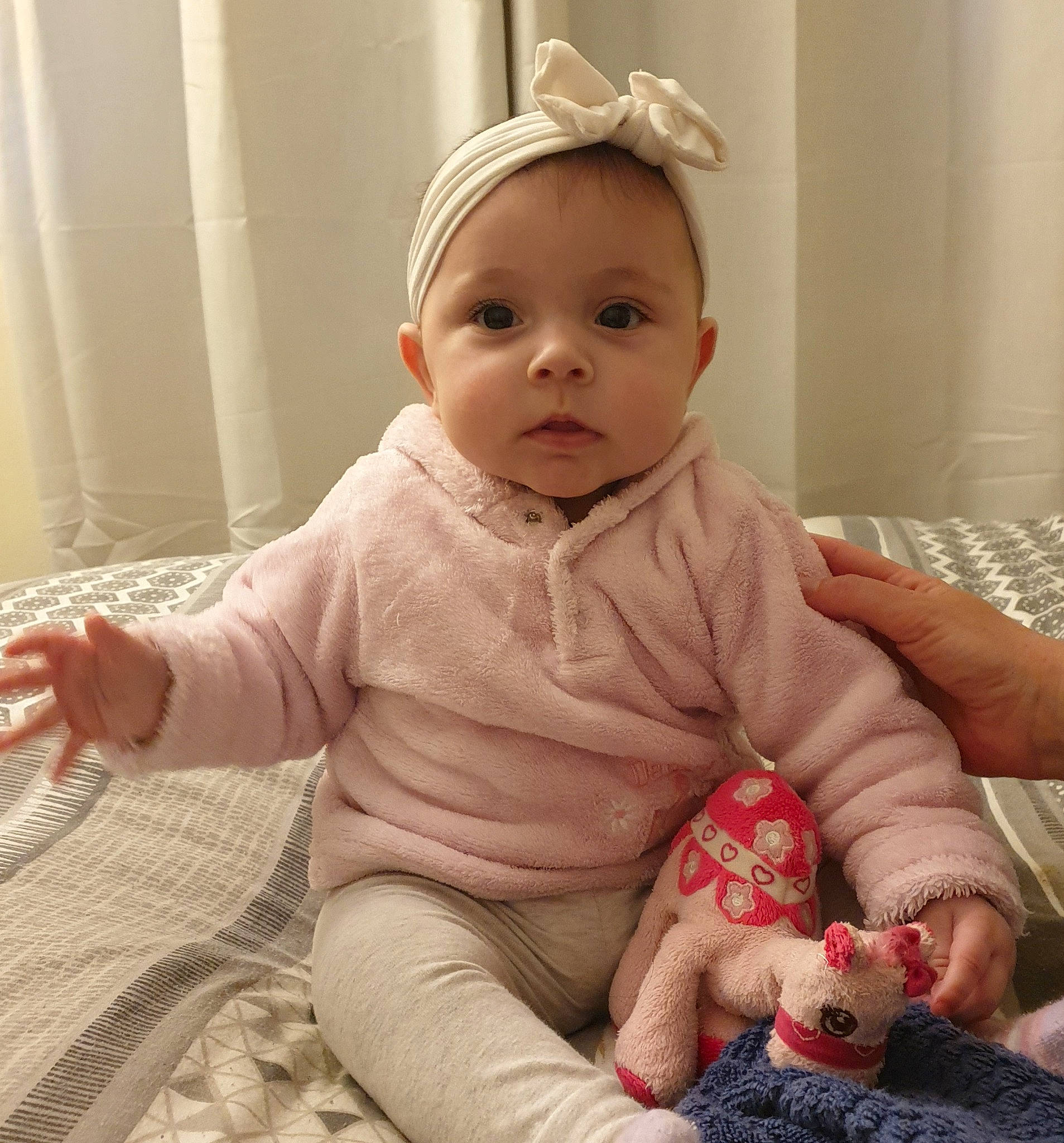 Sienna joined the competition — help win amazing prizes! baby, baby_toddler_clothing, cheek, chin, comfort, dress, eye, face, finger, hand, happy, head, human_body, iris, lip, mouth, nose, person, pink, skin