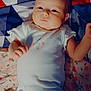 Maya is registered to the contest to win money with this photo: baby, infant, onesie, blanket, patterned_blanket, lying_down, curious, soft_lighting, indoor, child, cute, small_hands, face, head, skin, peaceful, newborn, portrait, sleepwear, resting