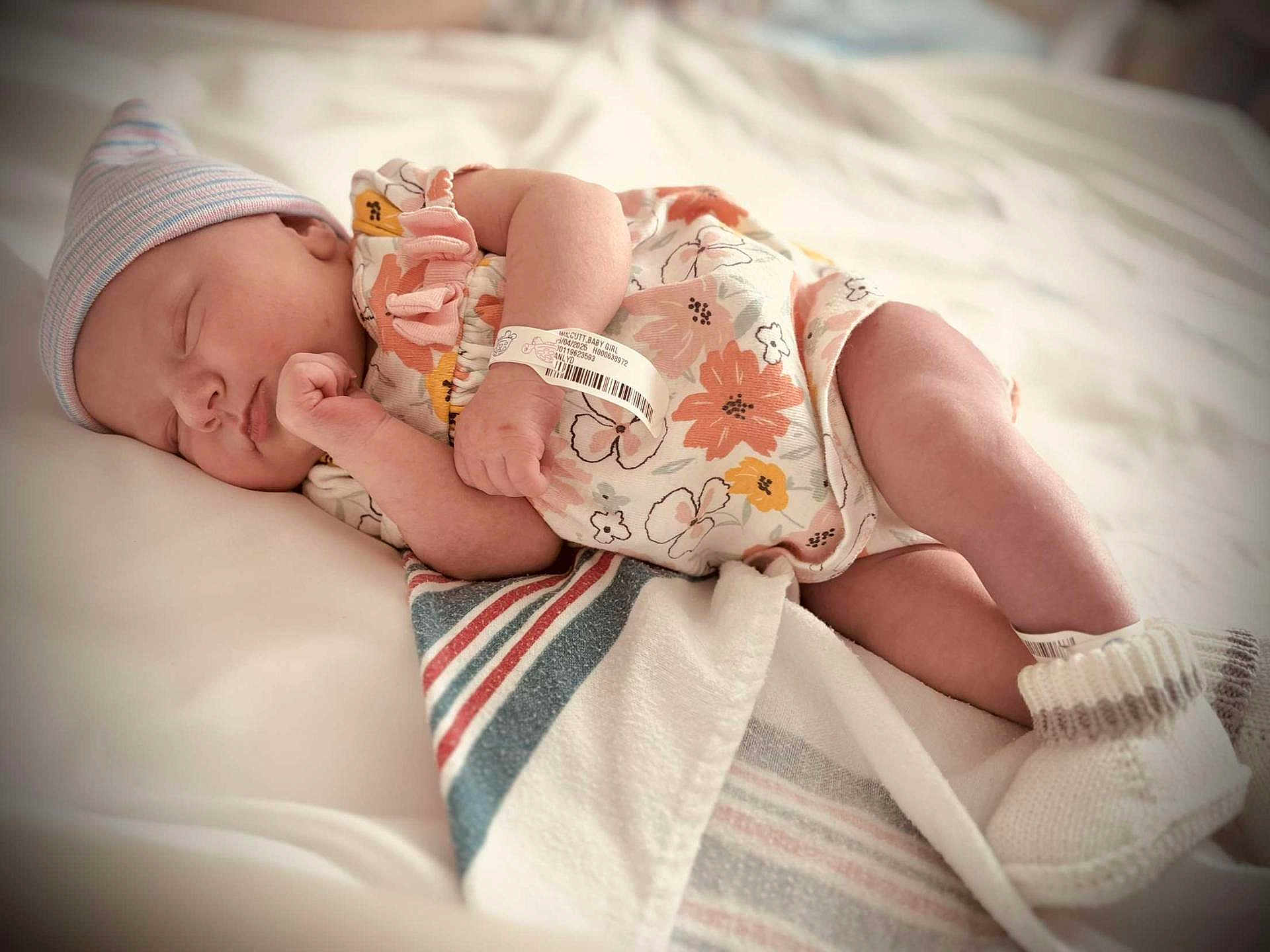 Maya joined the competition — help win amazing prizes! newborn, baby, sleeping, blanket, hospital, wristband, onesie, cap, infant, soft, cozy, peaceful, cute, resting, closeup, portrait, child, bed, comfort, skin