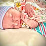 Maya joined the competition — help win amazing prizes! newborn, baby, sleeping, hat, onesie, floral_pattern, hospital_blanket, infant, cute, peaceful, soft_surface, hand, face, skin, child, portrait, resting, pink, striped, clothing