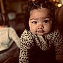 Areli joined the competition — help win amazing prizes! toddler, child, baby, cute, face, portrait, indoors, bokeh, hair_buns, spotted_clothing, warm_lighting, hand, crawling, curious, expression, soft_focus, young_child, infant, cozy, close_up