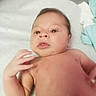 Askari is registered to the contest to win money with this photo: baby, child, close_up, cute, expression, eyes, face, fingers, hand, human, infant, innocent, lying_down, newborn, person, portrait, skin, small, soft_lighting, young