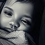child, face, blanket, close_up, portrait, monochrome, sleepy, soft_lighting, texture, baby, cozy, expression, young, wrapped, peaceful, head, eyelashes, nostrils, lips, hair