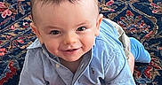 Cadence joined the competition — help win amazing prizes! baby, blue_shirt, child, clothing, crawling, cute, eyes, face, floor, hair, happy, head, indoor, patterned_rug, person, playful, rug, skin, smiling, toddler