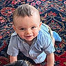 Cadence joined the competition — help win amazing prizes! toddler, child, baby, crawling, blue_shirt, smiling, indoor, rug, patterned_rug, floor, person, head, hair, happy, cute, playful, clothing, face, skin, eyes