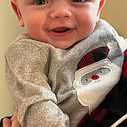 Cadence is registered to the contest to win money with this photo: baby, babylaughing, bodypart, clothing, coat, face, finger, hand, happy, head, jacket, knitwear, newborn, pants, person, photography, portrait, sitting, smile, sweater