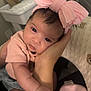 baby, infant, pink_bow, headband, cute, hand, arm, clothing, closeup, indoor, person, skin, face, eyes, adorable, newborn, soft, warm, resting, toddler