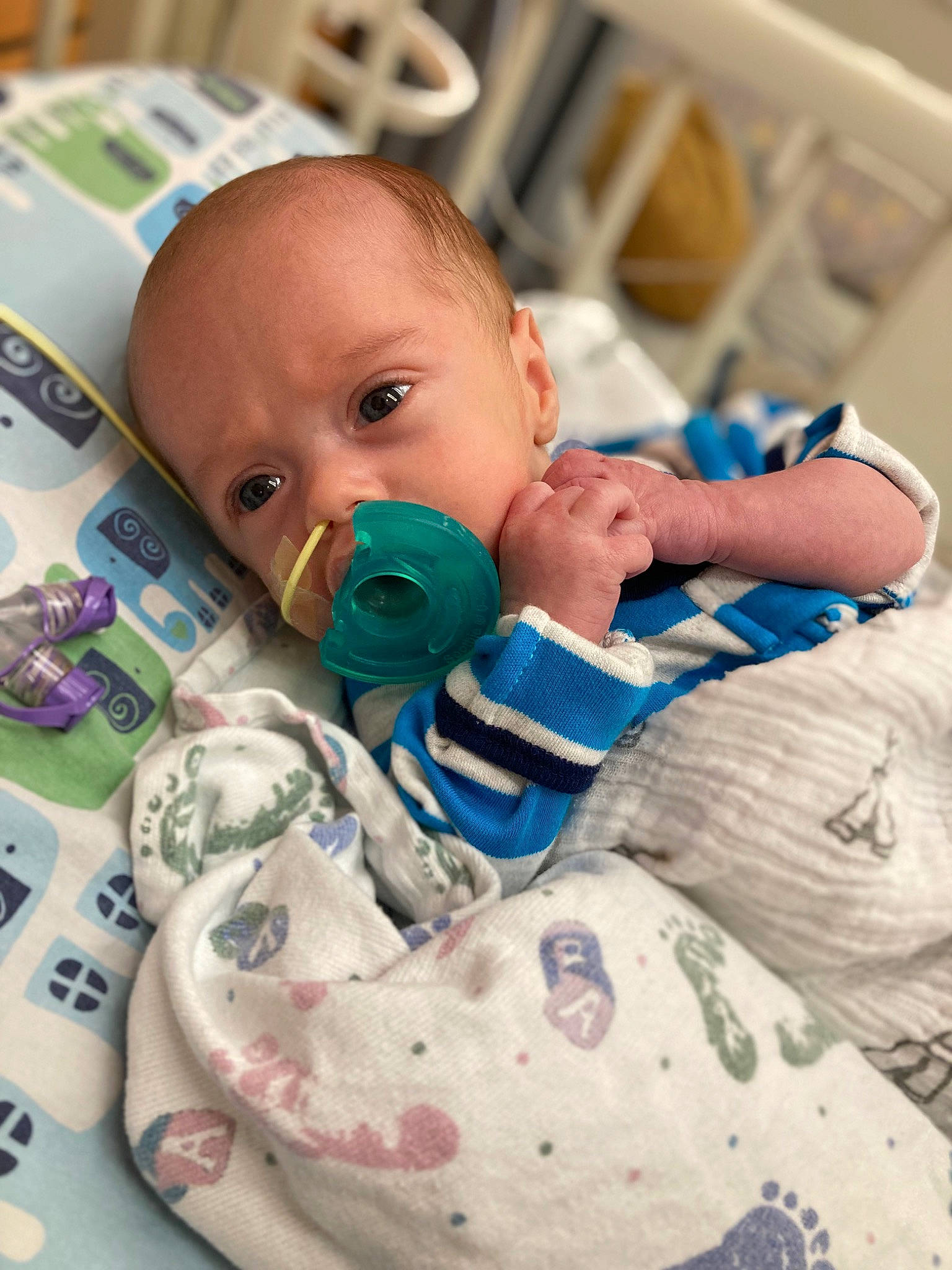 Max is registered to the contest to win money with this photo: baby, baby_products, baby_safety, baby_toddler_clothing, cheek, child, comfort, drinkware, eyelash, facial_expression, health_care, iris, linens, medical, mouth, person, plastic, room, service, skin