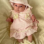 Aria participe au concours pour gagner de l'argent avec cette photo : baby, infant, pink_dress, bonnet, bows, socks, ruffles, blanket, texture, cute, child, portrait, laying_down, clothing, soft, adorable, face, hands, feet, indoors