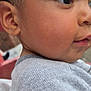 Maddox is registered to the contest to win money with this photo: child, toddler, face, profile, skin, eye, ear, hair, clothing, sweater, close_up, curious, innocence, portrait, young_child, person, casual, outdoor, soft_light, expression