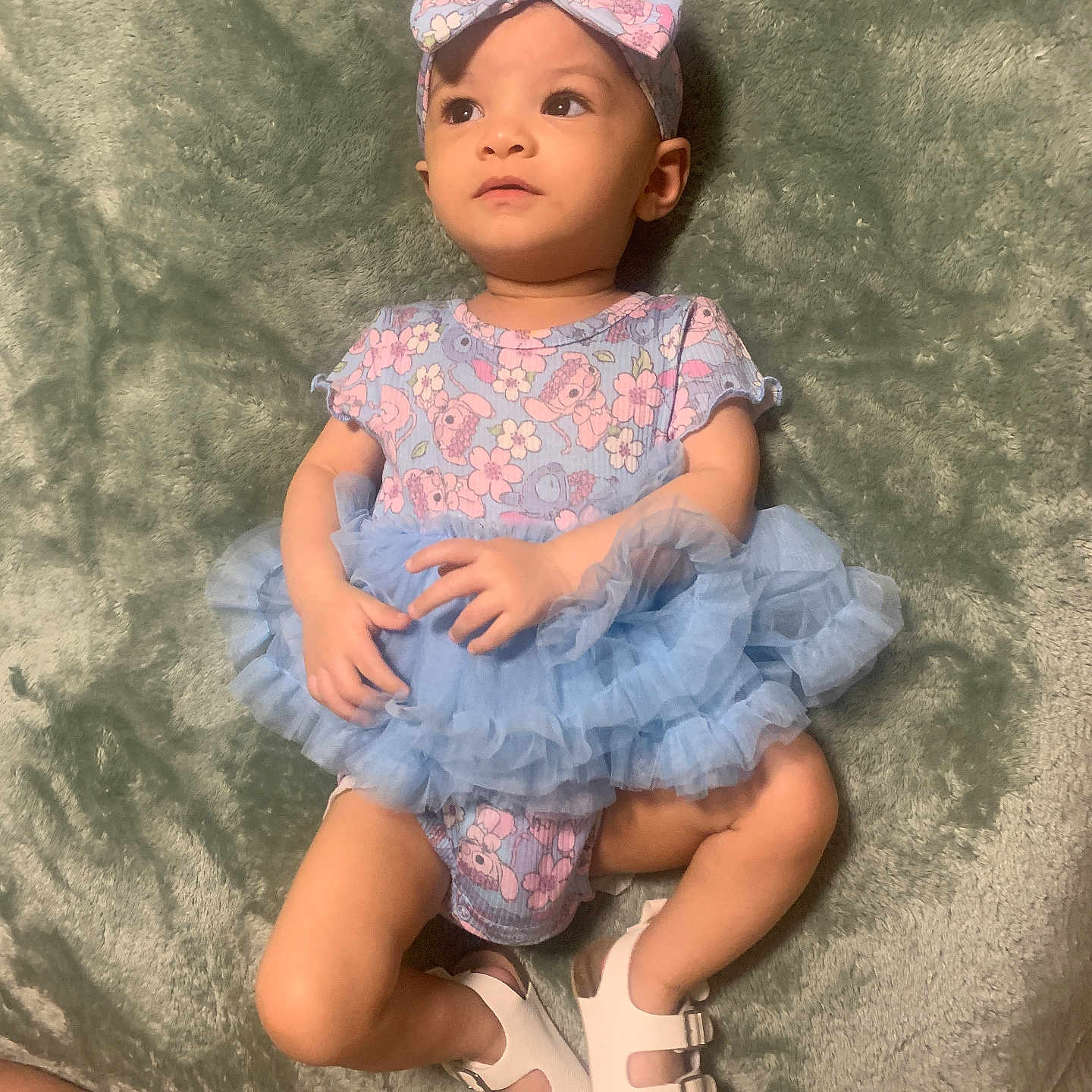 Anissa joined the competition — help win amazing prizes! baby, bonnet, cap, clothing, costume, couch, dress, face, footwear, formalwear, furniture, hat, head, person, photography, portrait, sandal, shoe, sitting, toy