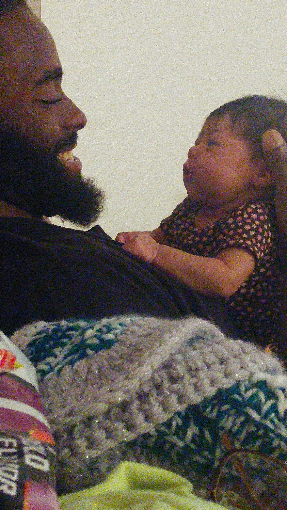 Avyanna is registered to the contest to win money with this photo: facial_hair, fun, girl, human, interaction, person, sitting, textile