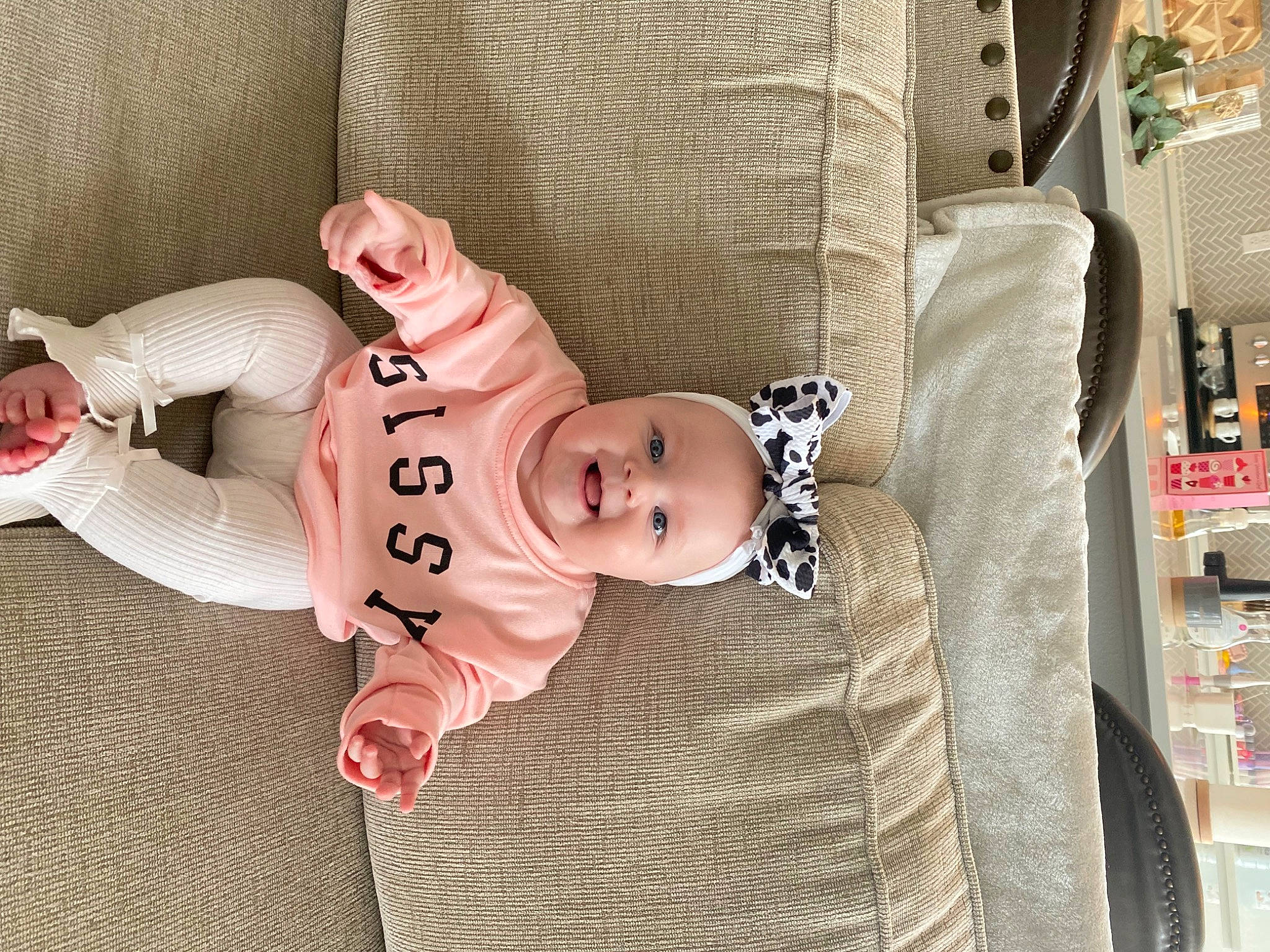 Tinslee is registered to the contest to win money with this photo: baby, baby_products, baby_safety, baby_sleeping, baby_toddler_clothing, child, comfort, flooring, foot, headgear, joy, linens, mammal, pattern, person, product, room, sitting, sleeve, textile